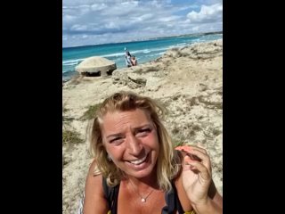 unknown milf show her boobs on the beach